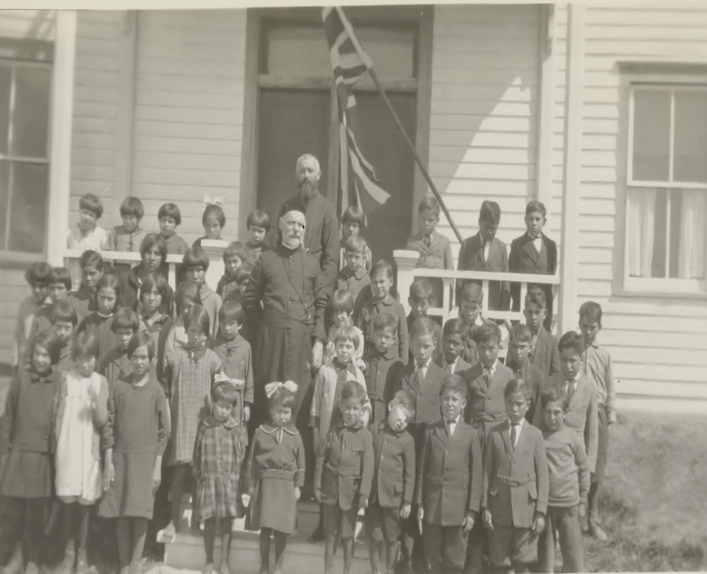 Group of students and teachers outside of Grouard St. Bernard's school