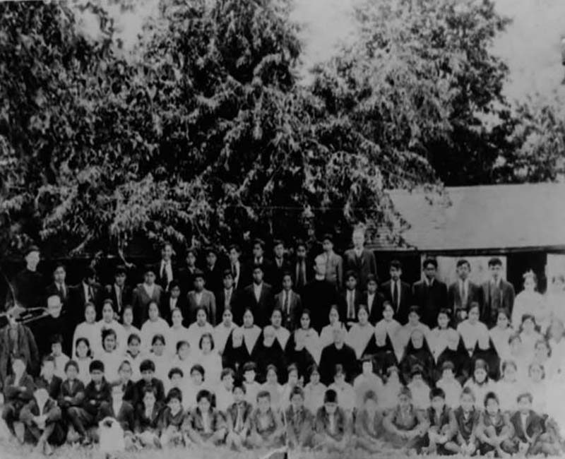 Group of students and teachers outside St. Mary Mission 