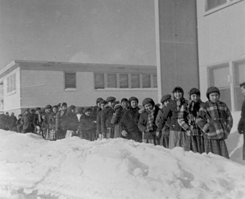 Group of children outside in snow at Bishop Horden Hall school