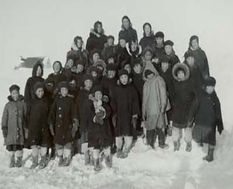 Group of students outside in the snow 