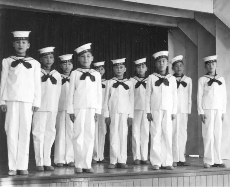 Group of students standing on stage from Cross Lake school