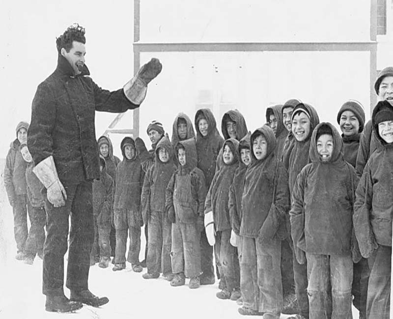 Group of students outside lined up at Fort George Church of England school