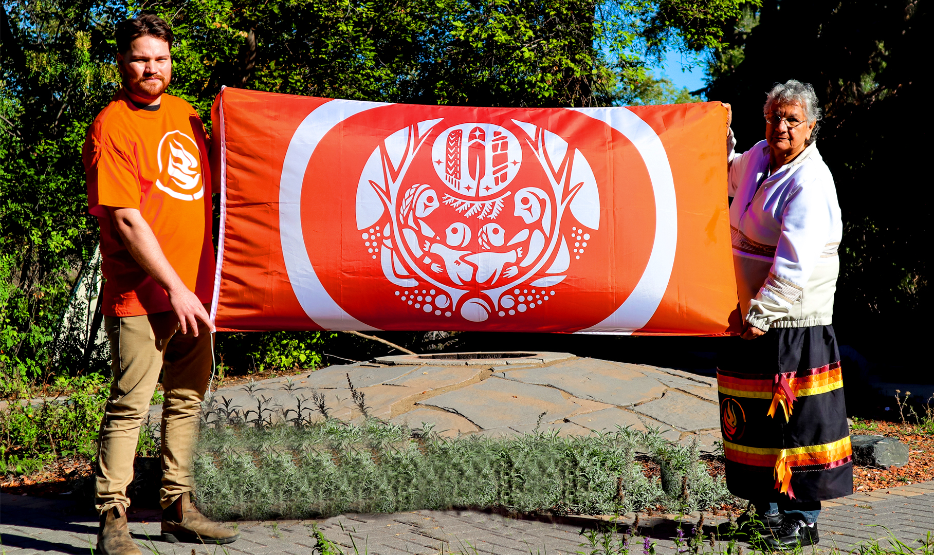 Elder and staff with the Flag