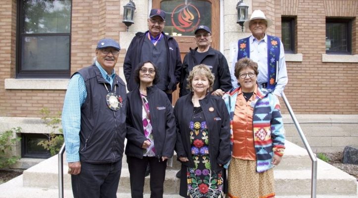 Eugene and Lorna Arcand standing with members of the Survivors Circle in front of the National Centre for Truth and Reconciliation.