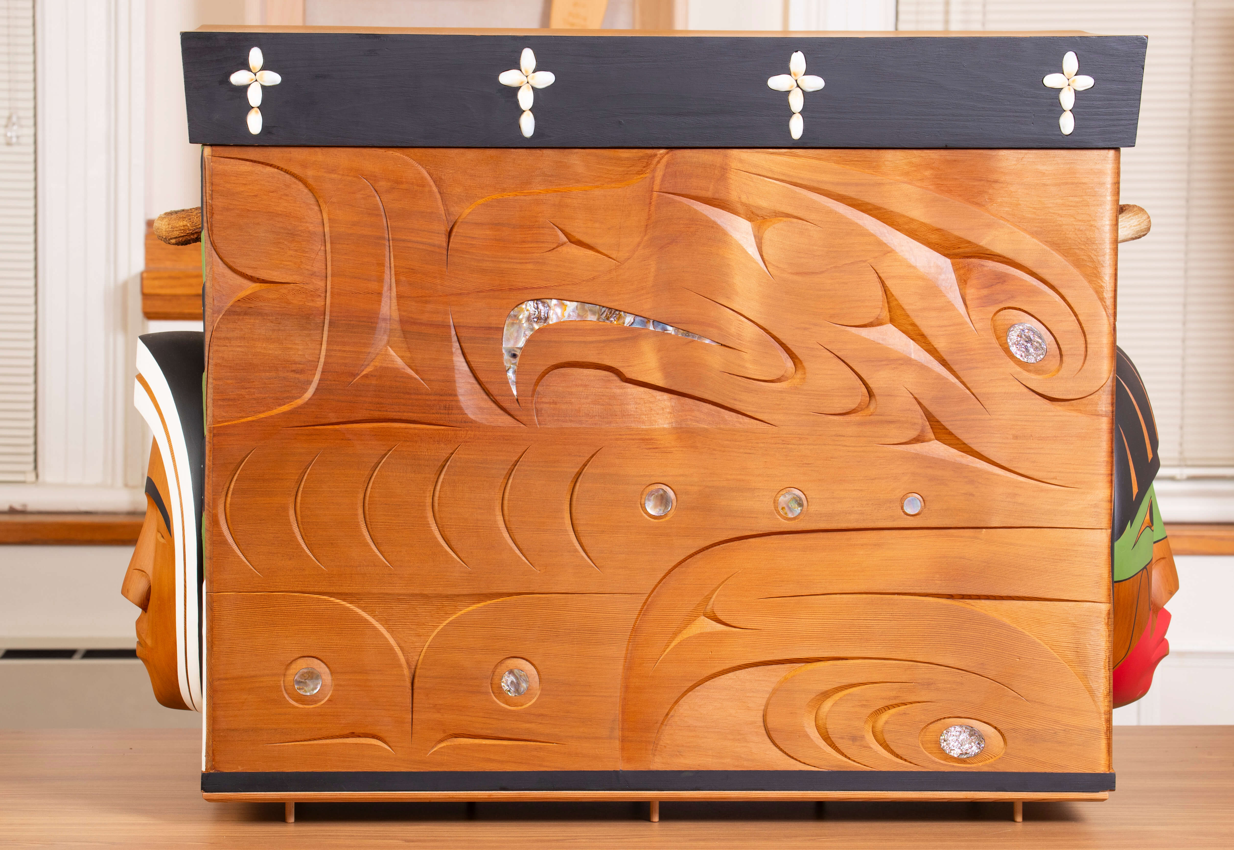 The back of the Bentwood Box, intricately carved with Indigenous imagery.